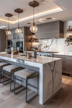 a large kitchen with marble counter tops and stools