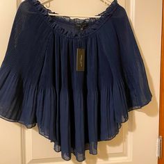 Cute Peasant Style Top In Navy Blue. Has Flared Sleeves With Elastic Neckline For Off The Shoulder. Never Worn With Tags. Size Medium. Blue Pleated Summer Tops, Blue Pleated Tops For Summer, Billowy Blue Summer Top, Billowy Blue Top For Summer, Summer Billowy Blue Top, Spring Bohemian Blouse With Crinkle Texture, Bohemian Blouse With Crinkle Texture For Spring, Bohemian Crinkle Texture Blouse For Spring, Blue Flowy Blouse With Ruffles