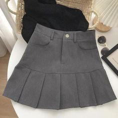 Stay ahead of the style curve in our chic pleated mini skirt. Designed for the fashion-forward, it features a belt looped high waist and a convenient zip & button fastening. Twin front pockets add a practical touch, while the under shorts provide extra coverage. Perfect for college and beyond, it's the skirt your wardrobe needs. Zip & button fastening Skater skirt Belt looped waist Polyester High waist Twin front pockets Skirt with under shorts A-Line skirt Kawaii Skirt, Preppy Mode, Mini Skirt Fashion, Elegant Dresses Short, Rok Mini, Womens Pleated Skirt, White Mini Skirts, High Waisted Pleated Skirt, Pencil Skirt White