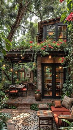 an outdoor patio with lots of plants and furniture