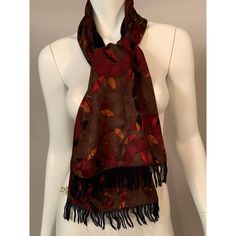 This reversible scarf is from the Georgina von Etzdorf archives and it has never been worn. The silk side has a Modernist print in burgundy, black, mustard, and white on a cocoa brown woven silk background.  The reverse side is navy blue wool with self fringe. The scarf has three labels, one for the designer and two for fabric content. It is in excellent condition.       Measurements;   Length 58” Width 10.5” Brown Silk Scarves For Fall, Black Silk Scarf For Fall, Formal Silk Scarf For Fall, Fall Multicolor Silk Scarf, Silk Background, Reversible Scarf, Cocoa Brown, Blue Wool, Scarf Print