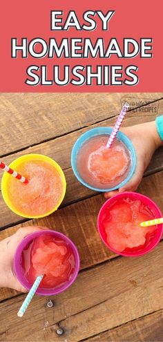 three small cups filled with homemade slushies on top of a wooden table