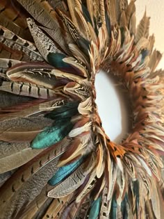 a close up of a wreath made out of feathers