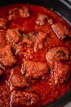 meatballs covered in marinara sauce in a slow cooker