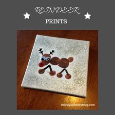 a reindeer made out of paper on top of a wooden table with text reading reindeer prints