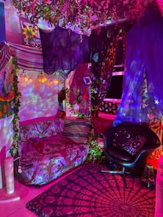 a room filled with lots of purple and pink decor