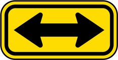 a yellow and black sign with two arrows pointing in opposite directions on the left side