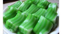 green candy sitting on top of a white plate