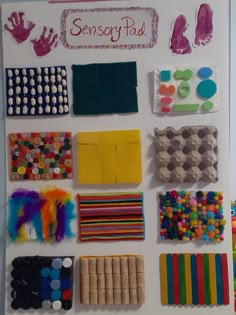 an assortment of crafting supplies displayed on a white board with writing and handprints