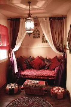 a living room filled with lots of red furniture