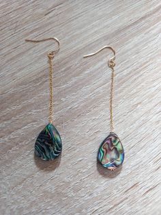 These beautiful earrings are made from real abalone shell. These abalone earrings are durable, lightweight and very elegant. They will make a perfect gift for someone special in your life or just because you deserve it.  Each shell is unique, therefore, please expect a small variety from the shell on the photographs. The French ear wires on these earrings and dainty chain filled with gold.  Each item is carefully packaged in an elegant jewelry box ready as a gift. If you would like to add a personalized note with your order, just write a note at checkout and I will send a small card with your gift to the recipient. If you need a bigger quantity or any customized jewellery for your very special occasion (birthdays, weddings, bridal showers or any other event), please send me a message and I Abalone Shell Drop Earrings, Elegant Abalone Shell Teardrop Earrings, Elegant Teardrop Abalone Shell Earrings, Teardrop Abalone Shell Jewelry With Matching Earrings, Teardrop Bridal Earrings, Abalone Jewelry, Abalone Earrings, Crystal Teardrop Earrings, Earrings Beach