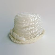 "This vintage women's white cellulosic bucket/cloche/pillbox hat featuring a 5 3/4\" width offset bow and 1 3/4\" height upturned brim is 6\" in height, and 21 3/4\" around the perimeter of the interior comfort band (approximately a size 7 medium)... very avant-garde." Vintage White Wide Brim Bucket Hat, Vintage White Mini Hat With Short Brim, White Adjustable Cloche Mini Hat, White Bucket Hat For Party, White Cloche Mini Hat For Church, Vintage White Cloche Hat, White Wide Brim Hat For Gift, White Bucket Hat As Gift, White Wide Brim Hat As Gift