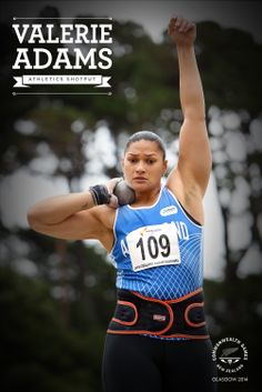 a female athlete raising her arm in the air