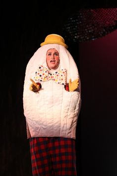 a woman dressed as a clown on stage