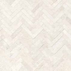 a white marble herringbone tile pattern that looks like it could be used as a wallpaper