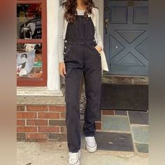 Elevate Your Fashion Game With Our "Black Denim Chic Jumpsuit." This Women's Straight-Leg Overall Exudes Style And Versatility. Crafted From High-Quality Denim, It Offers Both Comfort And Durability. The Chic Design Effortlessly Combines A Classic Black Hue With Modern Aesthetics. Whether You're Out For A Casual Day Or A Night On The Town, This Jumpsuit Is Your Go-To Choice For A Sleek And Fashionable Look. Embrace Confidence And Sophistication With This Wardrobe Essential. Casual Straight Leg Overalls For Fall, Black Relaxed Fit Denim Overalls, Black High-waisted Denim Jumpsuit With Pockets, Black Denim Overalls For Fall, Black Cotton Overalls Jeans, Casual Shortalls For Workwear In Fall, Casual Fall Workwear Shortalls, Black Denim Overall Jumpsuit, Black Denim Jumpsuit With Straight Leg And Pockets