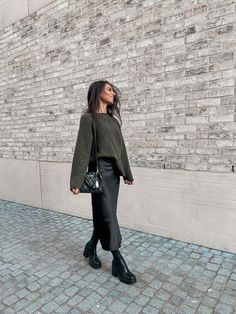 Black Silk Skirt And Sweater, Silk Dress Boots Outfit, Midi Skirt Turtleneck Outfit, Silk Skirt Chunky Sweater, Workwear Midi Skirt, Midi Black Silk Skirt Outfit, Winter Long Skirt Outfit With Boots, Casual Black Silk Skirt Outfit, Black Full Midi Skirt Outfit