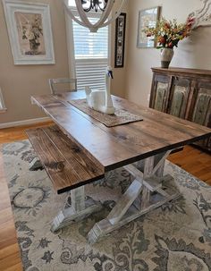 a wooden table sitting on top of a rug