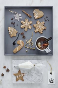 a tray filled with cookies and other decorations