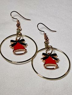 Dangle Hoop Red Bell Earrings are just shy of 2.25 inches long. These charming earrings are perfect for Christmas, parties, date nights, or for whatever you can imagine. The French wire on these earrings is hypoallergenic.  Please be aware that the French wire that goes in your ear is a slightly different color gold than the gold hoop it's attached to. If that is an issue for you, please do not purchase these earrings. Hoop Earrings For Valentine's Day Party, Valentine's Day Hoop Earrings For Party, Valentine's Day Party Dangle Hoop Earrings, Small Red Hoop Earrings For Party, Red Small Hoop Earrings For Party, Red Hoop Jewelry For Festive Occasions, Red Hoop Earrings For Valentine's Day Party, Red Earrings For Valentine's Day Holiday, Festive Red Hoop Jewelry