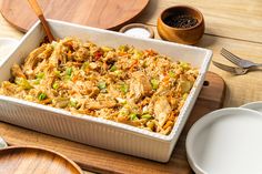 a casserole dish with chicken and vegetables in it