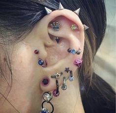 a woman with some piercings on her ear