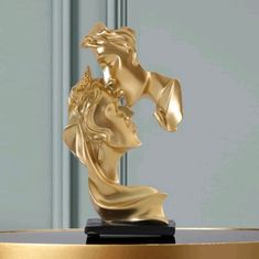 a golden statue on top of a table