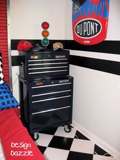 a black and white checkered floor in a room with a tool box on top of it