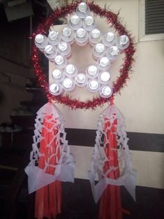 a heart shaped decoration made out of cans