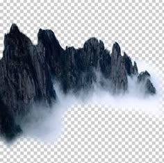 the mountains are covered in fog and clouds, with one mountain rising up from the ground