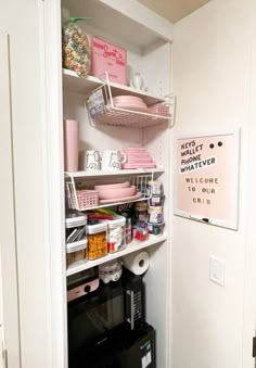 the pantry is stocked with pink dishes and other items