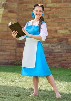 a woman in a blue and white dress holding a book