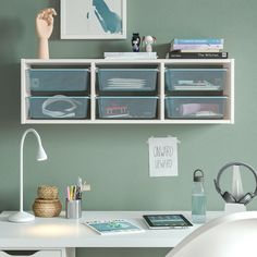 a white desk topped with lots of drawers