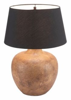 a brown vase with a black shade on it and a white background behind the lamp