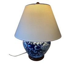 a lamp with a blue and white design on it