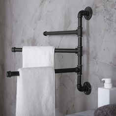 a towel rack with two towels hanging on it