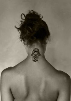 a woman with a tattoo on her back