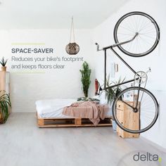 a bed room with a bike mounted to the wall