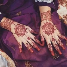 hendi tattoos on the hands of a woman