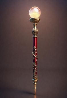 a red and gold pole with a glass ball on it's top, in front of a dark background