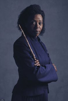 an image of a woman holding a wand