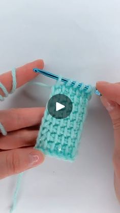 someone crocheting something with yarn in their hands and the video is being displayed