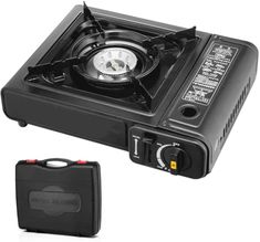 an electric stove with the lid open next to a small black case on a white background