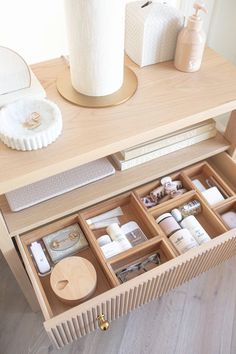 an open drawer on top of a wooden table