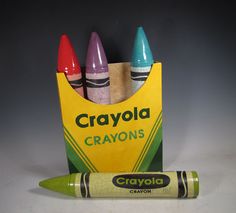 crayons are in a bag next to a pencil