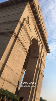 people are standing in front of the india gate