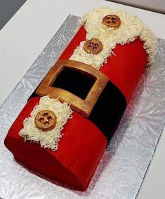 a cake made to look like a fireman's hat with buttons on it