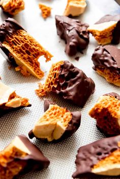 chocolate dipped honeycomb candy on a baking sheet with the words, how to make homemade honeycomb candy