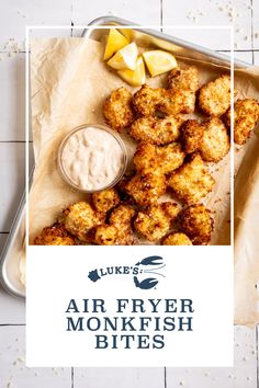 a tray filled with fried food next to a bowl of dip and some sliced apples