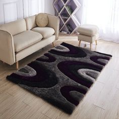 a living room with a couch, chair and rug